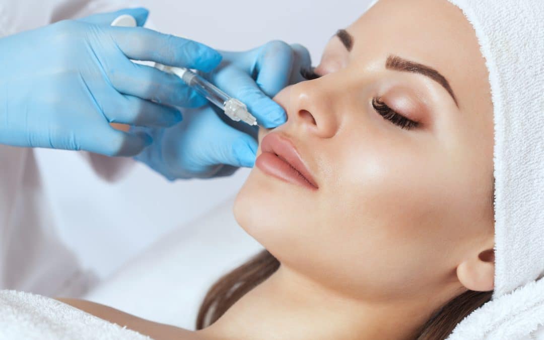 doctor cosmetologist makes Lip augmentation procedure