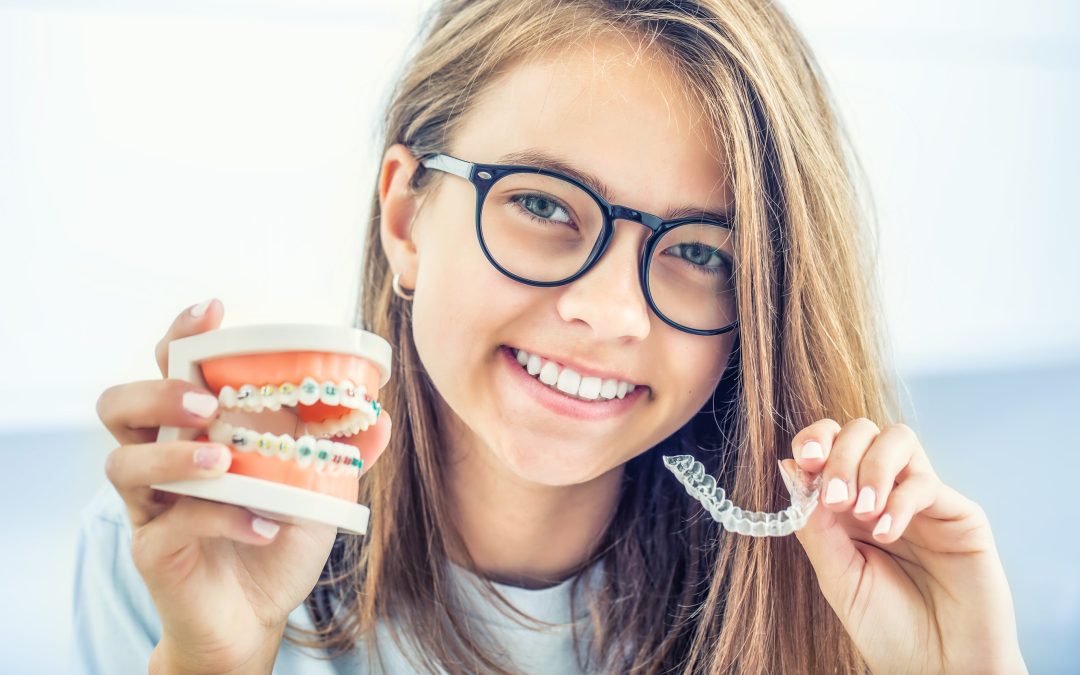 Dental invisible braces or silicone trainer in the hands