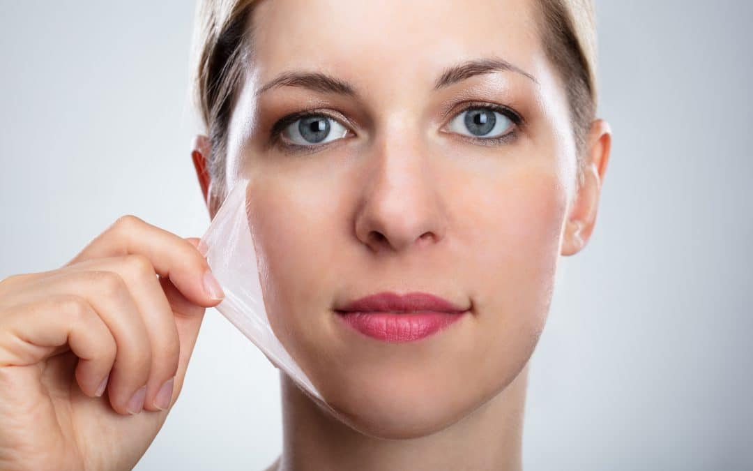 Woman Removing Peeling Mask From Her Face